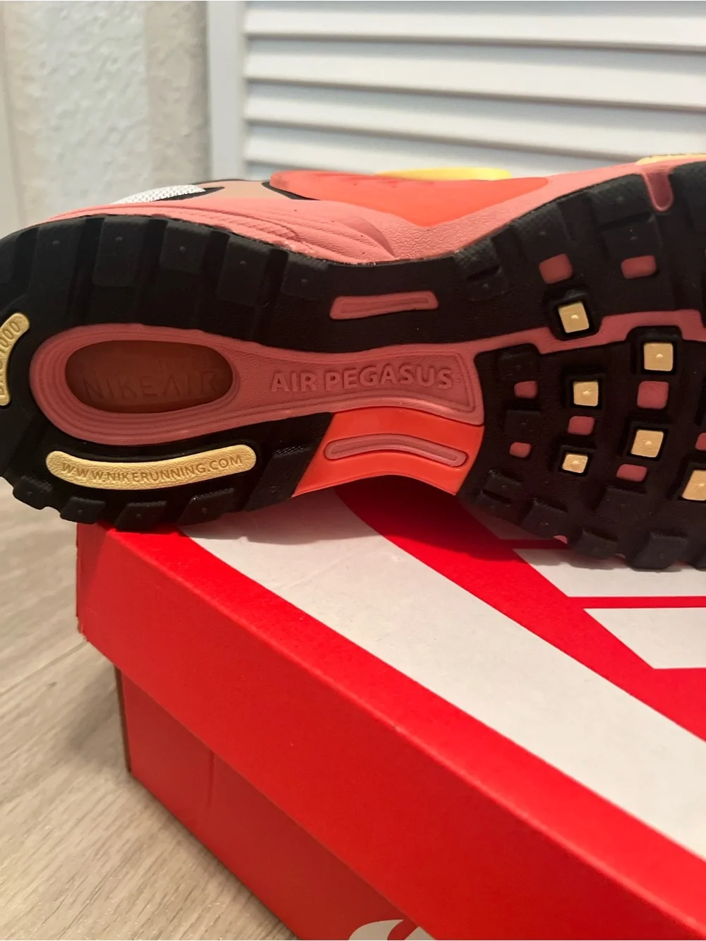 Nike men’s Pink and Gray Sneakers with Yellow Swoosh